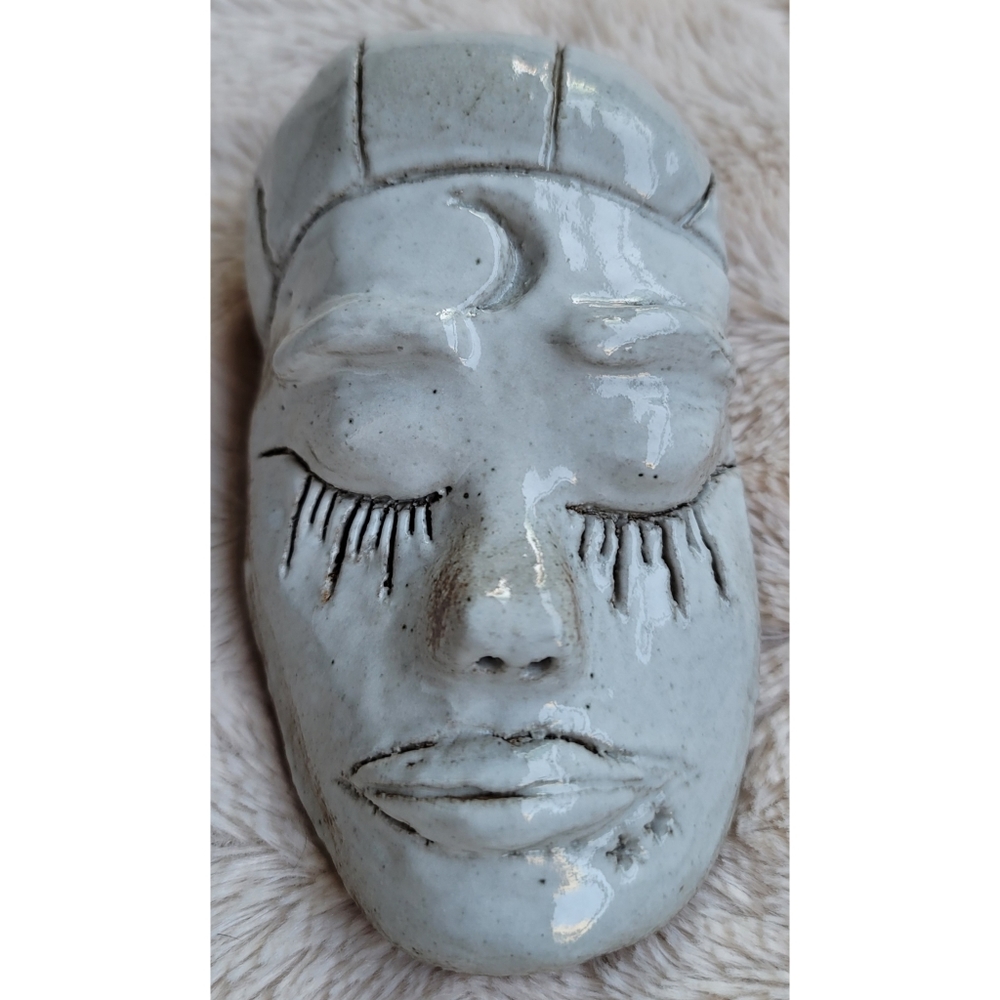 Red clay with white glaze pottery face